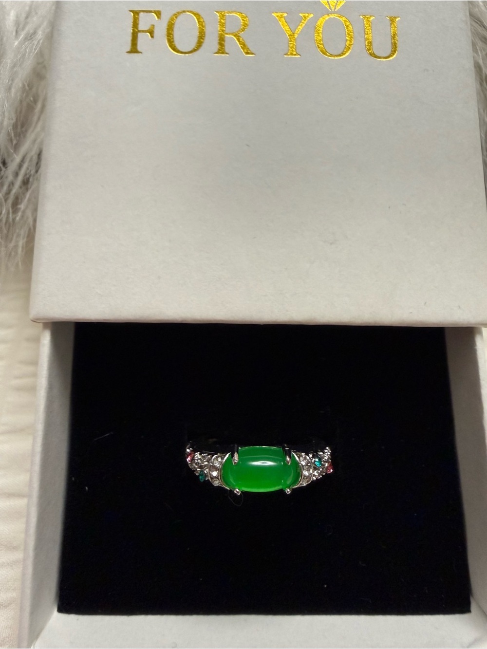 Emerald Green Cabochon Ring with Sparkling Accents